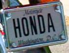 undated black-on-white personalized motorcycle plate HONDA