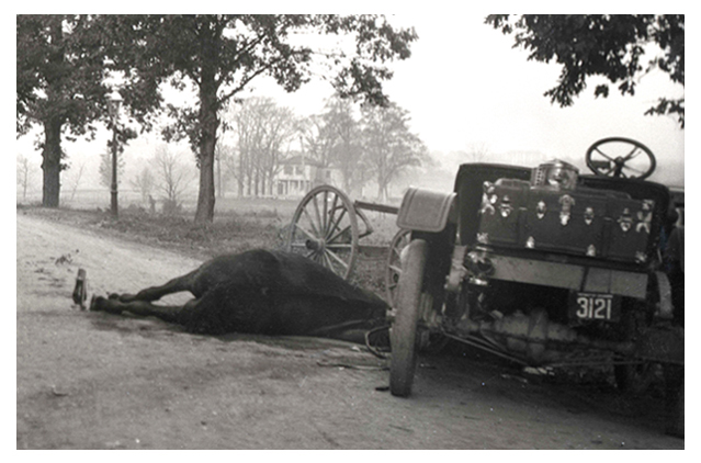 Scene of collision between horse-drawn and horseless carriages