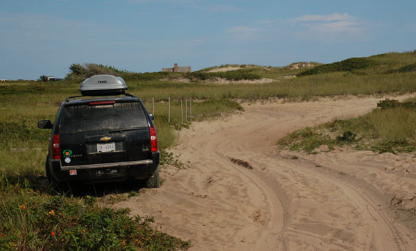 D.C. auto plate no. DK-0244 on a Chevrolet Suburban parked at Ladies Beach on Nantucket, Mass.